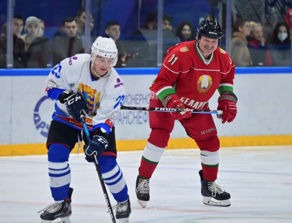 Belarus president Lukashenko, right, playing ice hockey as the migrant crisis rages on