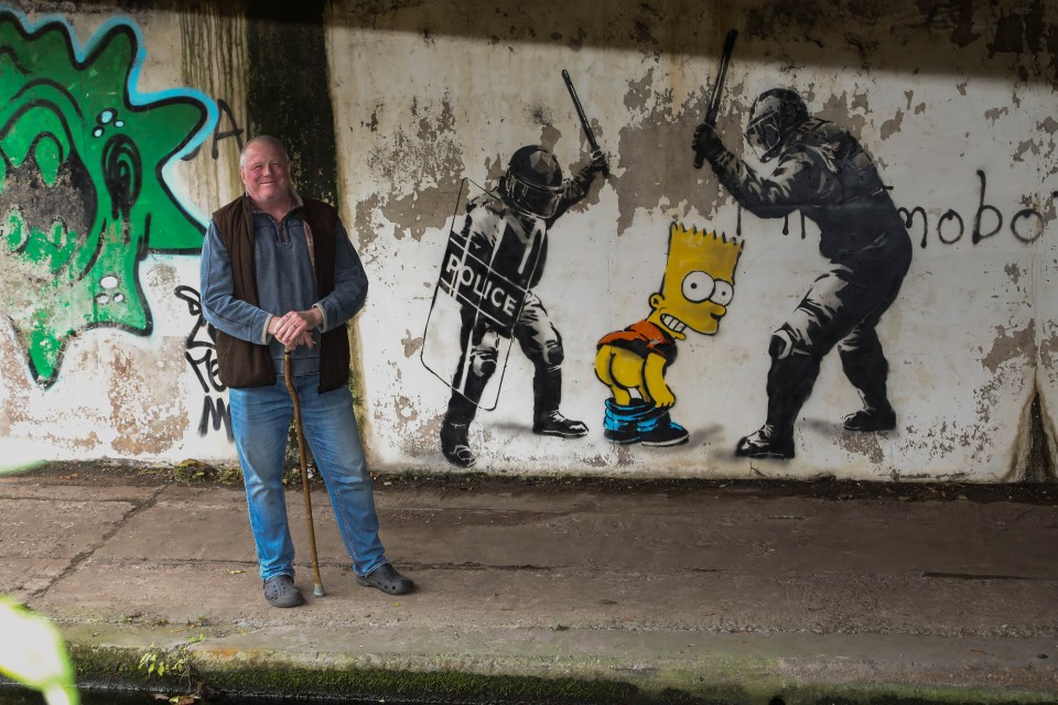 Darrell stood next to the mural of Bart Simpson mooning