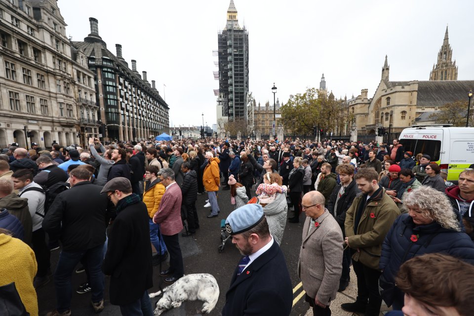 Crowds bow their heads as a two minute silence is held