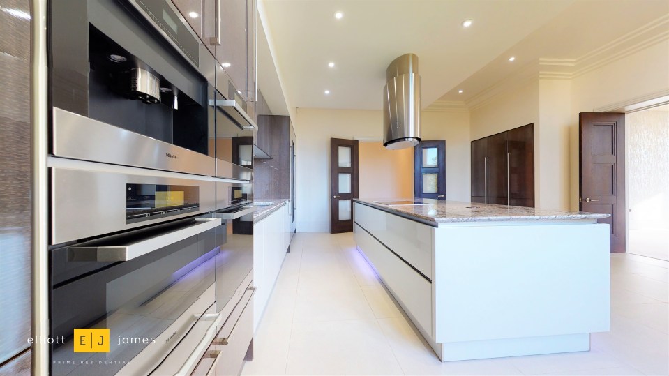 The pad features a stunning modern kitchen