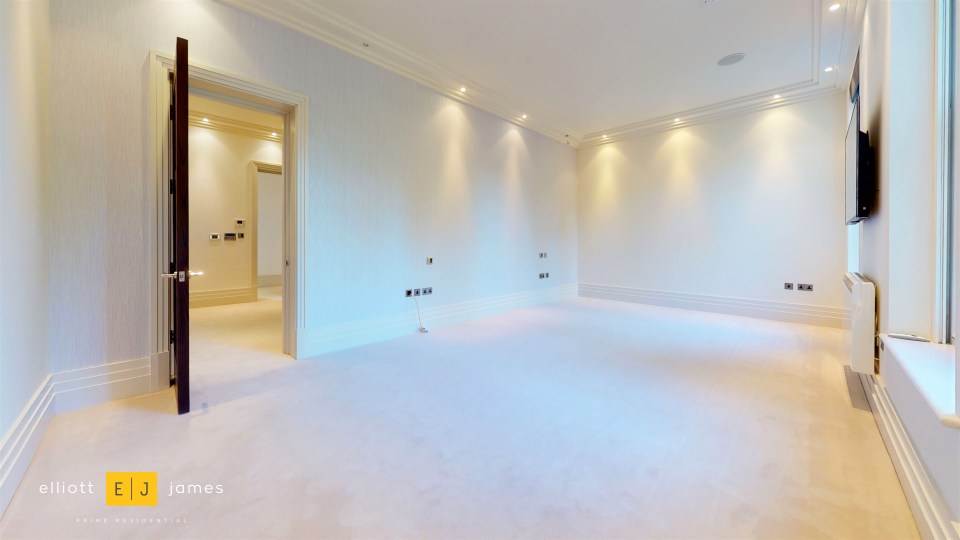 The property has white walls and carpet throughout