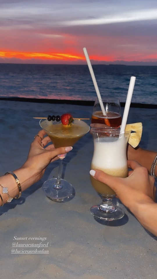 The girls sipped fruity cocktails and watched the sun set