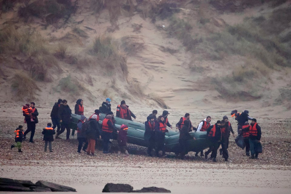 More than 40 migrants were pictured launching dinghies into the English Channel this morning