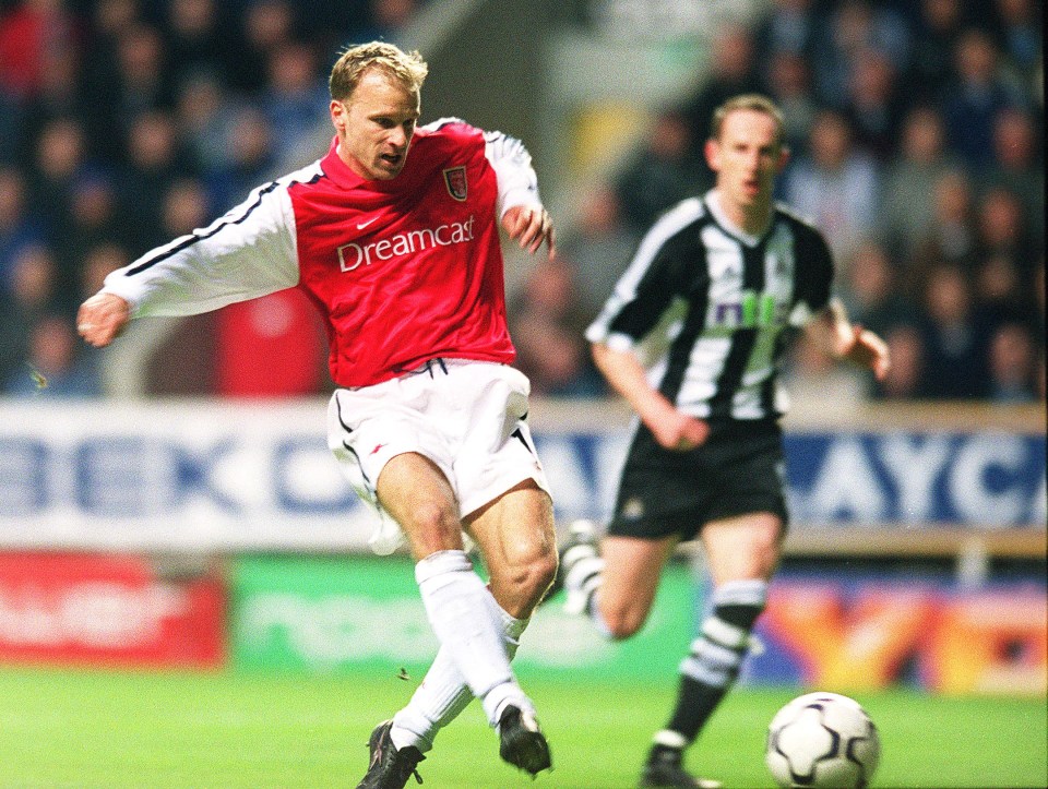 Dennis Bergkamp of Arsenal scores the top goal