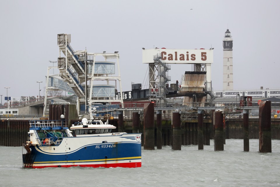 Skippers have moved their trawlers into the harbour mouth at Calais to stop ferries