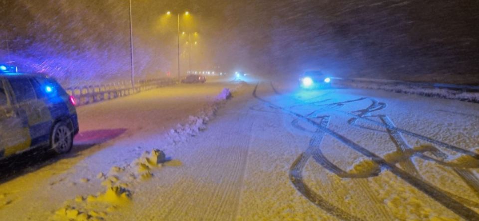 Severe weather has closed major roads, including a section of the M26, and a railway across the country