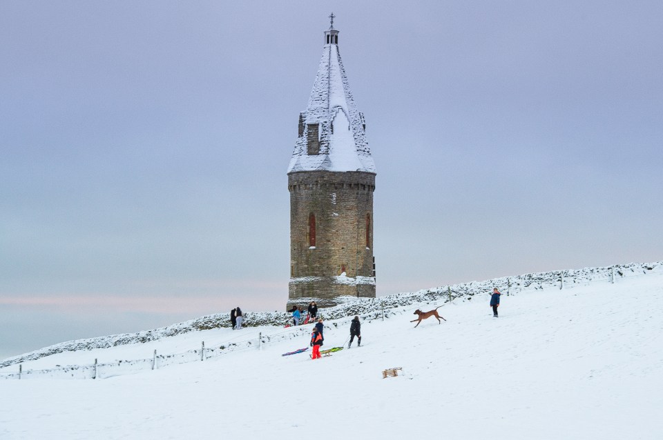 Children were spotted sledging in thick snow in Mossley, near Ashton-under-Lyne