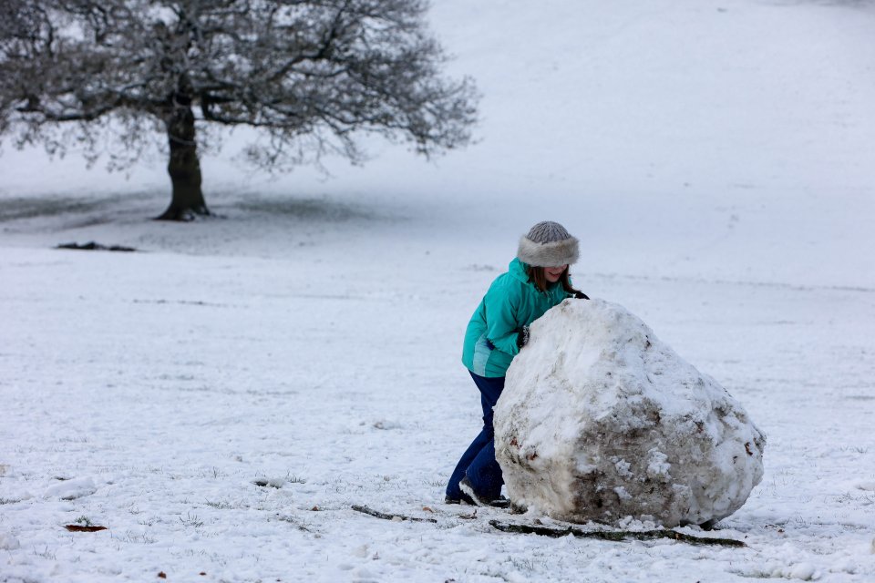 Rosanna Christian ,12, enjoying the wintry day making a snow ball at Warley Woods Park in Birmingham yesterday