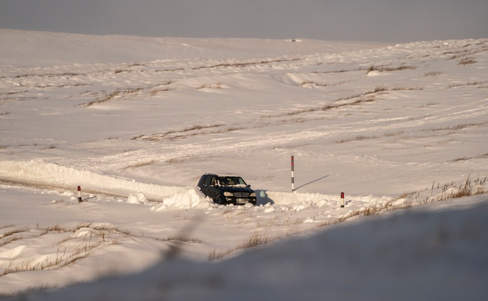 High drifts piled up alongside the Buttertubs Pass in North Yorkshire