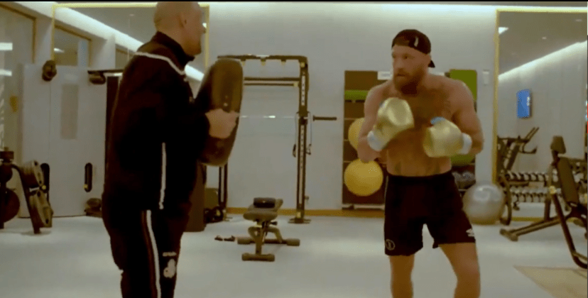 The UFC's first simultaneous two-weight world champ  is already back on his feet hitting pads