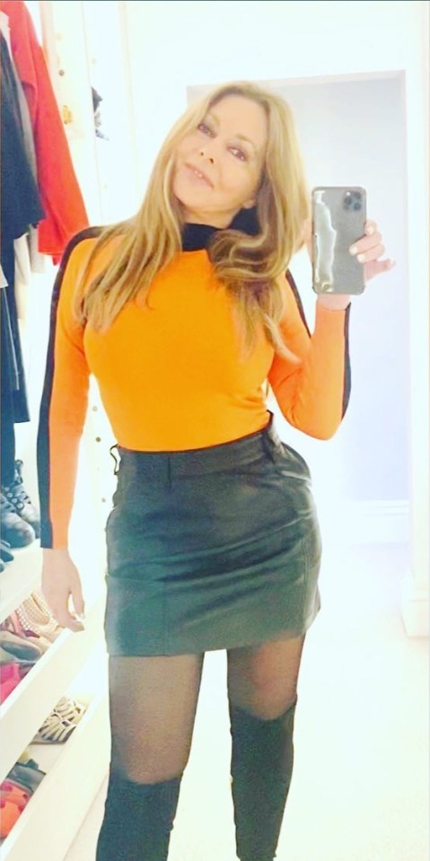 Carol Vorderman wowed in a leather mini skirt and a skintight tangerine top