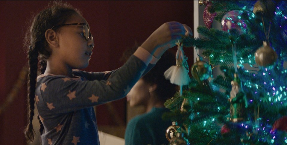 The advert tells the story of a teenage alien experiencing Christmas for the first time