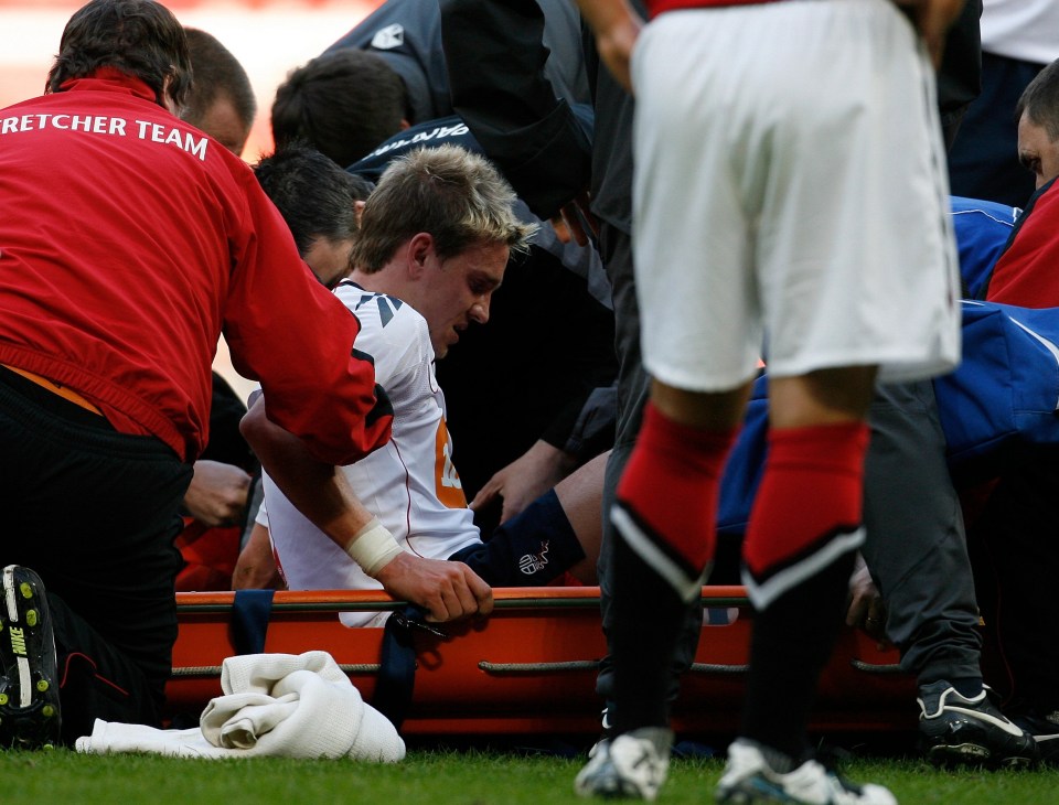 Holden is taken off on a stretcher after Evans' reckless tackle