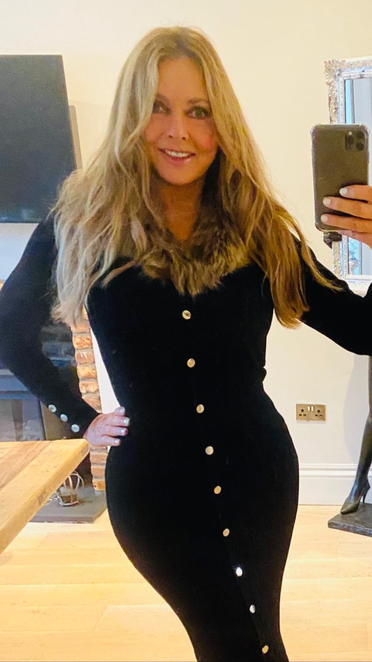 Carol showed off her impressive curves in this navy dress