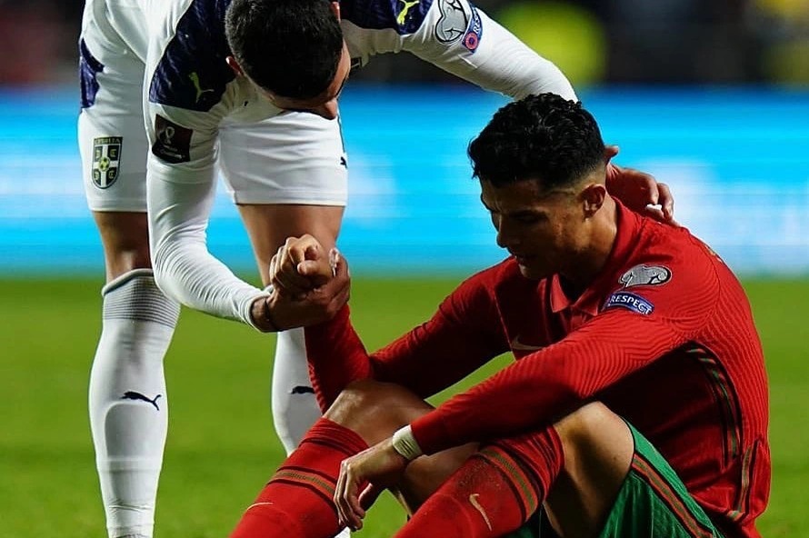 Cristiano was comforted by his Serbian duplicate after Portugal's shock loss to the European minnows in the World Cup qualifier