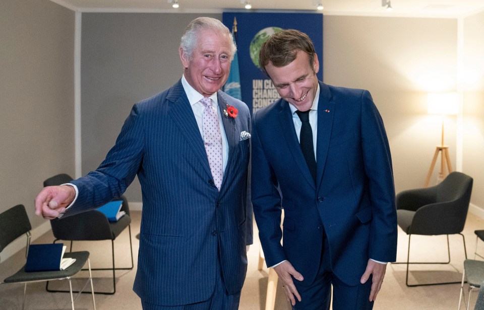 Mr Macron was snapped laughing during a meeting with Prince Charles