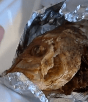 A woman sparked outrage after she said she brought a box of fried fish onto a flight