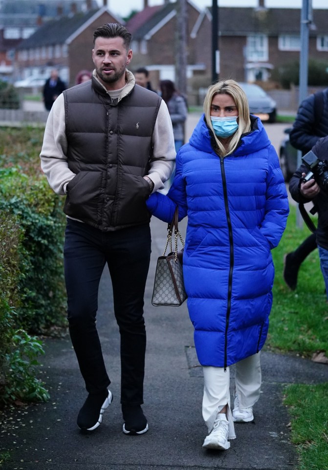 Katie Price holding hands with Carl Woods as they leave Crawley Magistrates' Court