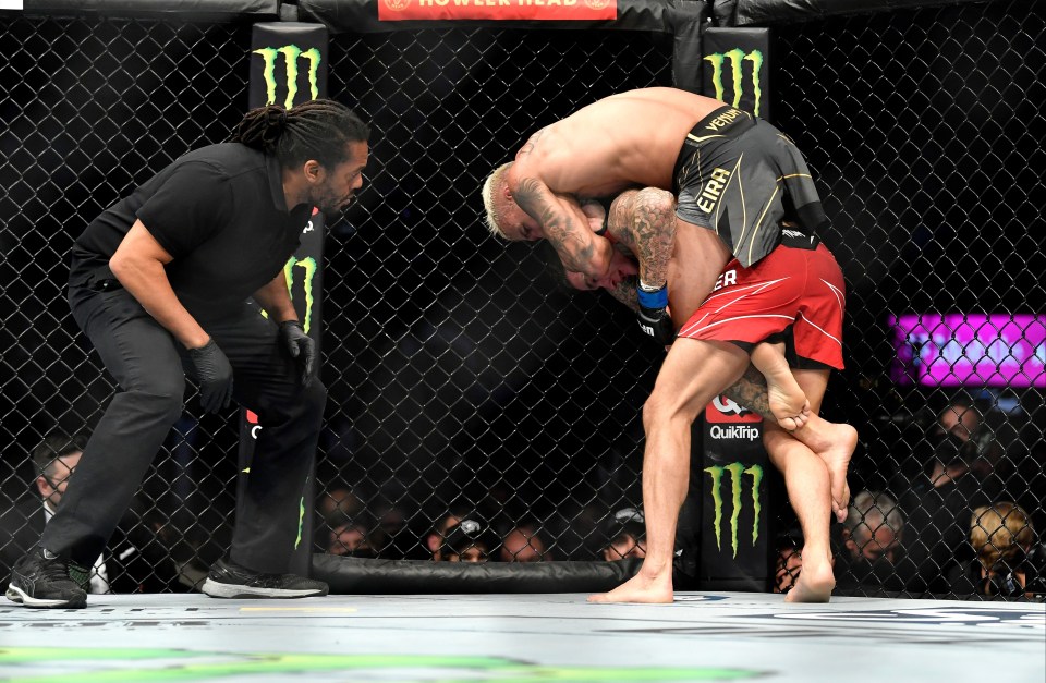 Oliveira sunk in a beautiful rear-naked choke after taking Poirier's back in the third