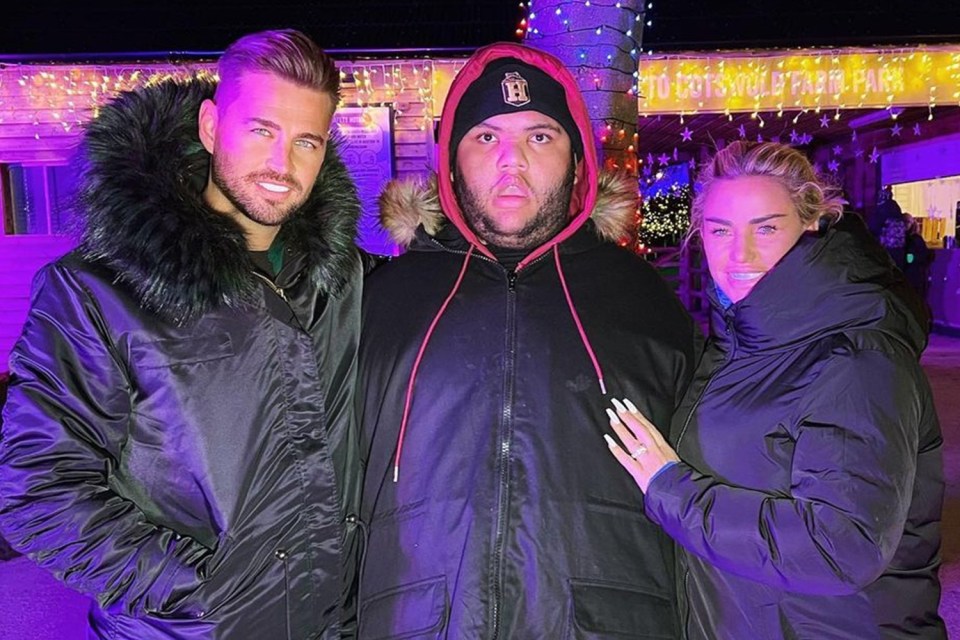 Katie Price's fans think she looks pregnant in this photo with fiancé Carl Woods and son, Harvey