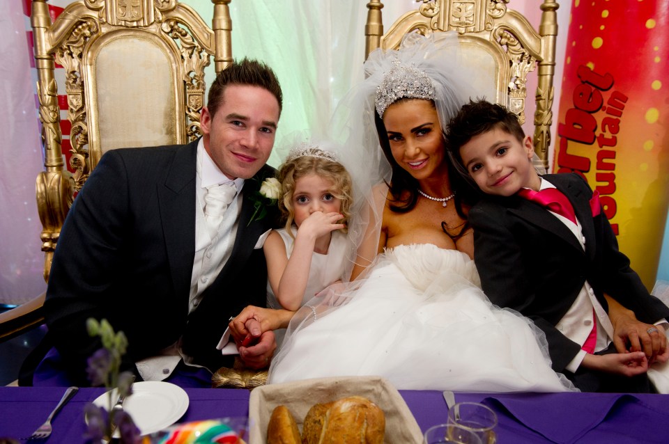 Katie and Kieran on their 2013 wedding day alongside her kids Princess and Junior