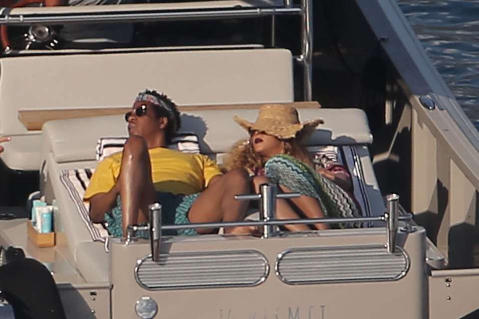 Rapper Jay-Z and his wife Beyonce relaxing on the deck of the Kismet