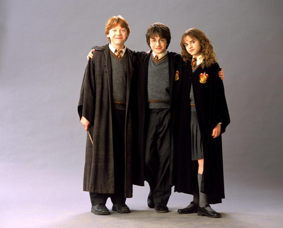 Daniel Radcliffe, Emma Watson and Rupert Grint as Harry Potter, Hermione Granger and Ron Weasley