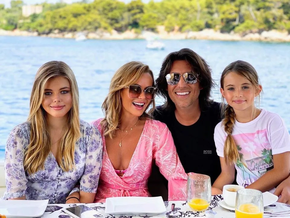 Amanda is pictured alongside her husband Chris Hughes and their two daughters, Alexa and Hollie