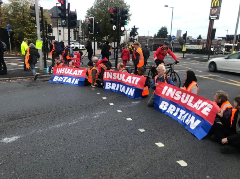 Insulate Britain members block the road near the Dartford Crossing and the A40 in West London