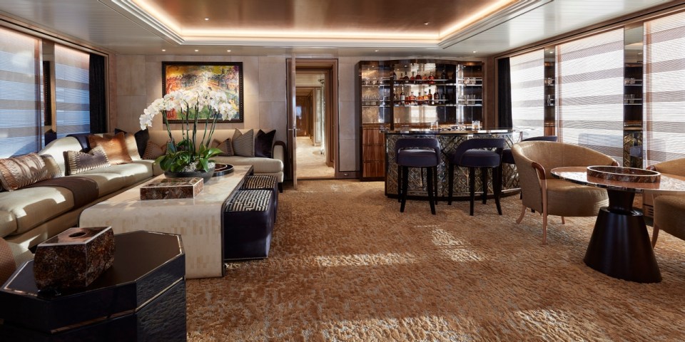 A comfortable living room is equipped with a full bar