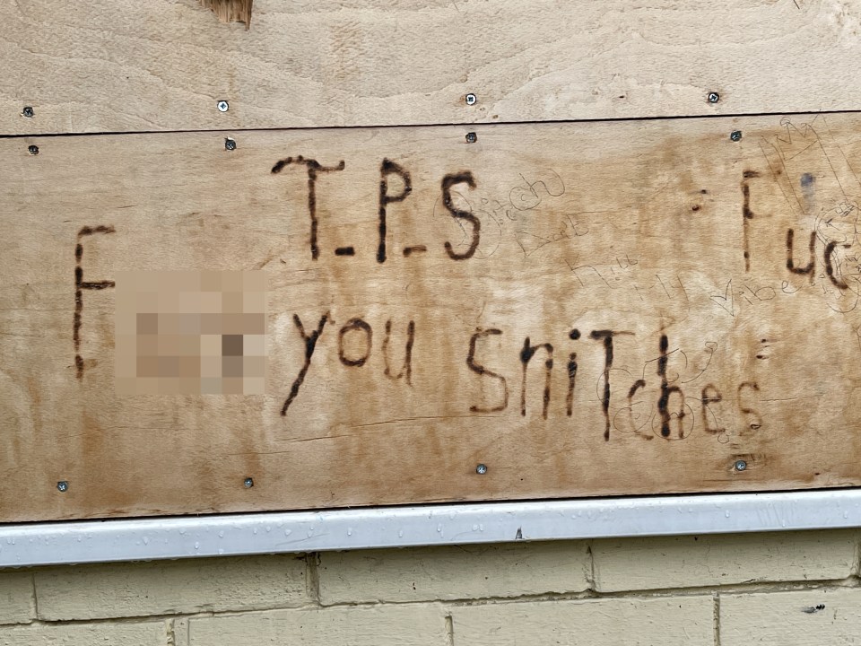 It appears that in response to residents' complaints, a crude message has been daubed on the exterior of the boarded-up flat