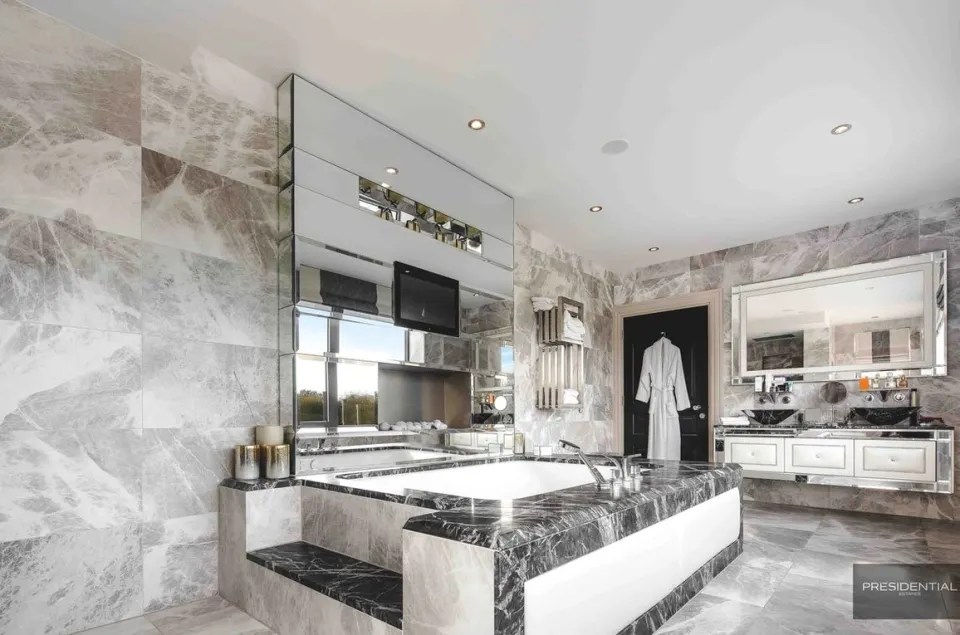 Marble covers the en suite bathrooms