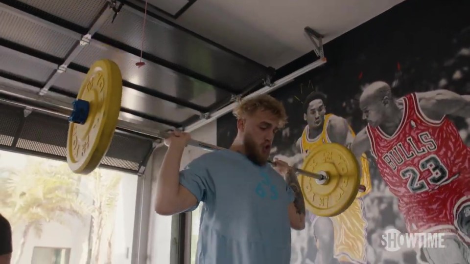 Paul could be seen lifting weights in a promo video