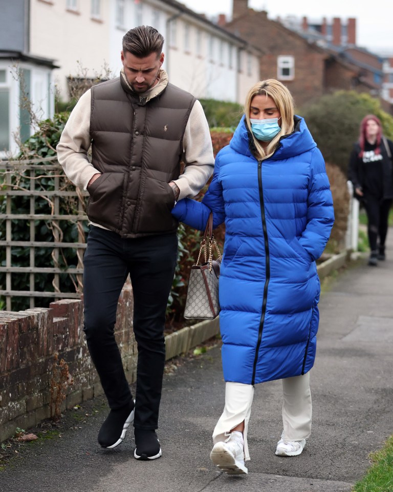 Katie and fiance Carl Woods as they arrived home after she attended court on December 15