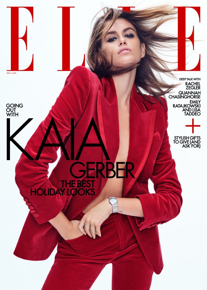 Kaia sports a artfully tailored red tux on the cover of Elle