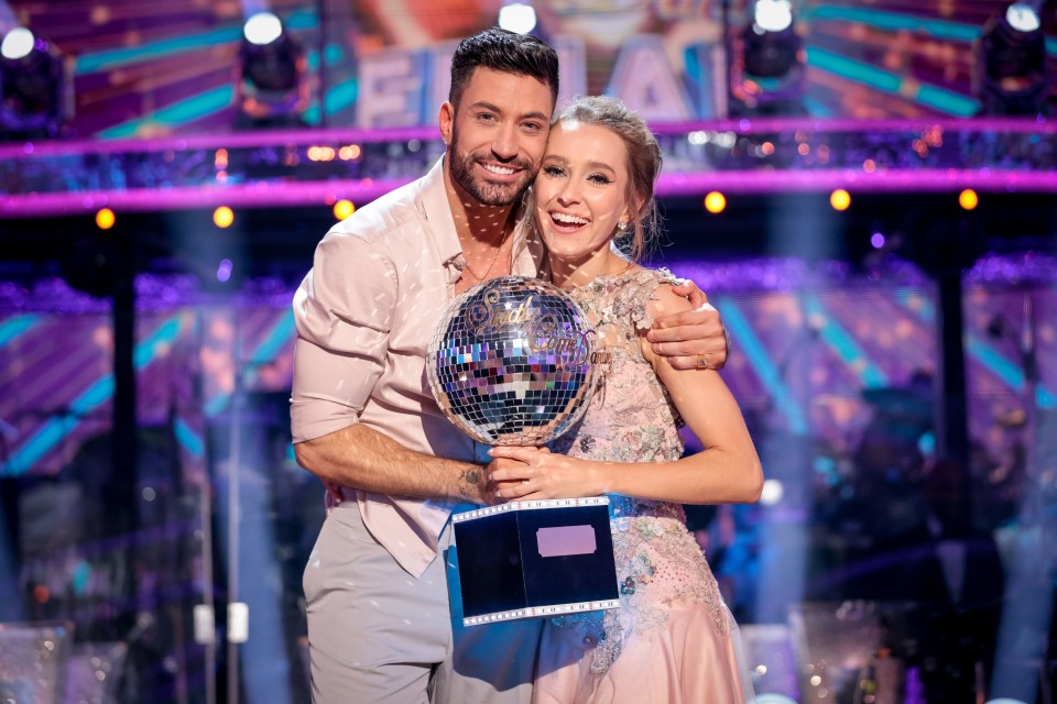 Rose Ayling-Ellis and Giovanni Pernice hold the famous Glitterball trophy after being crowned Strictly 2021 champions