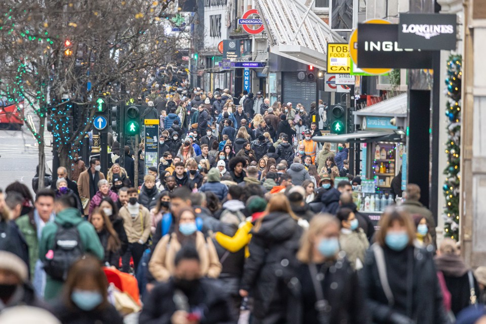 Shoppers in a packed Oxford Street London with only three shopping days left before Christmas