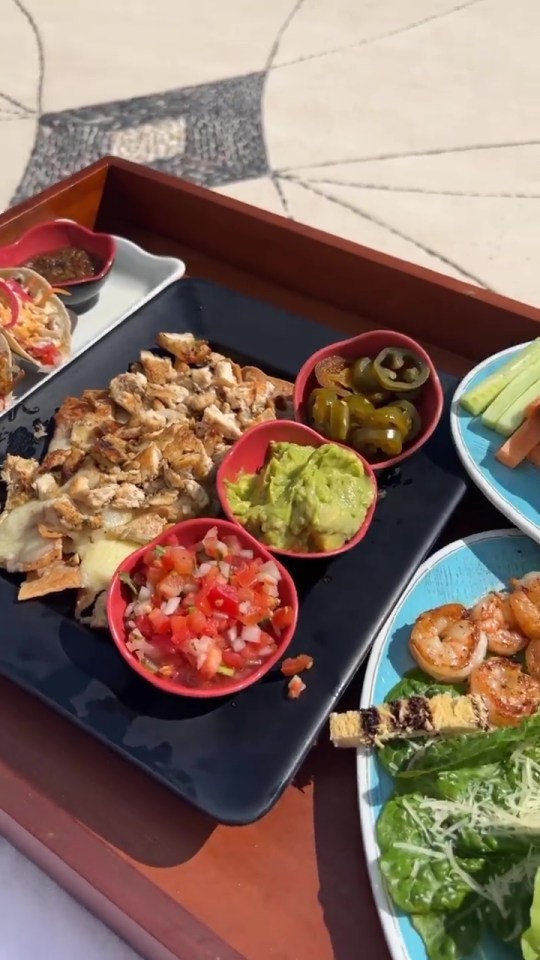 The couple chowed down on delicious food as they sat poolside