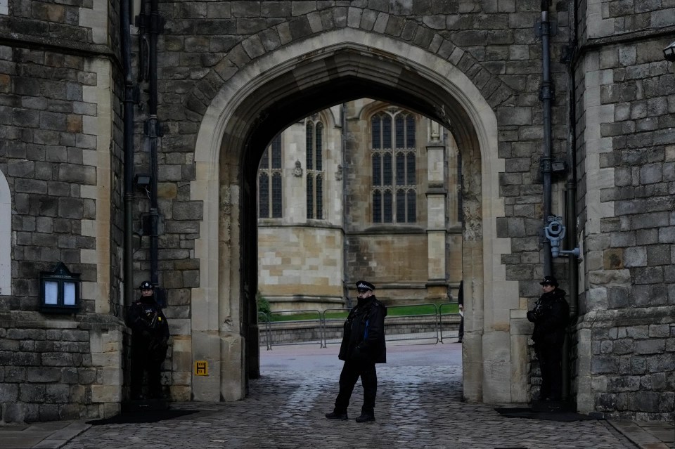 Police guard the Henry VIII gate at Windsor Castle after an armed intruder tried to break in this morning