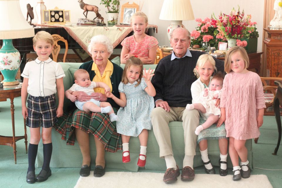 Queen Elizabeth and Prince Philip pose with their great grandchildren (L-R) Prince George, Prince Louis being held by Queen Elizabeth II, Savannah Phillips (standing at rear), Princess Charlotte, Prince Philip, Duke of Edinburgh, Isla Phillips holding Lena Tindall, and Mia Tindall in 2018