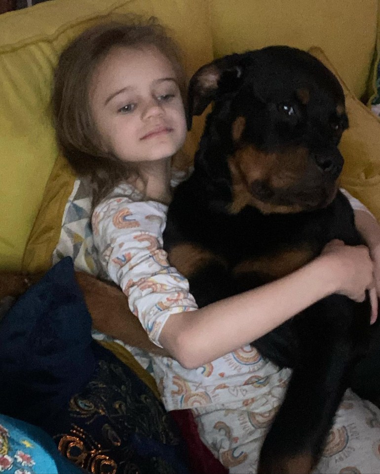 Kerry showed her daughter Dylan-Jorge cuddling the huge dog