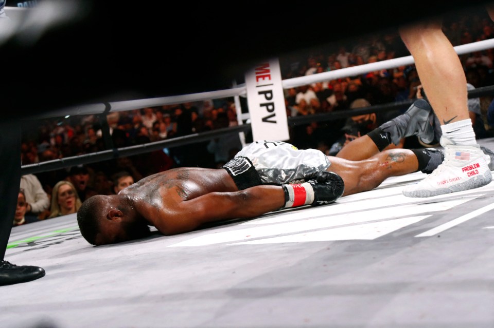 Woodley was left face down in the ring