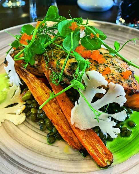 Enjoy the most succulent local salmon with lentils and roasted veg at restaurant Eldhúsið