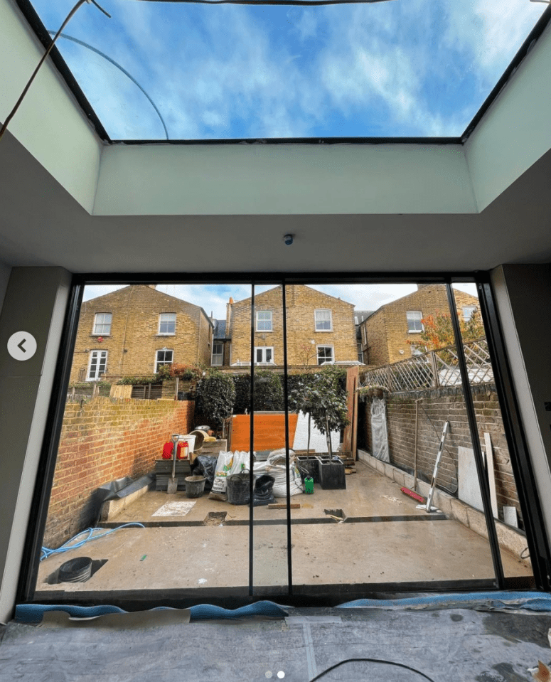 They installed huge glass doors to allow plenty of light the basement