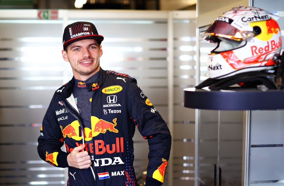 Verstappen also showed off his 'champions' hat in the paddock