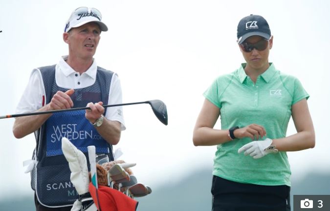 Mike Dean caddied for Oz golfer Whitney Hillier at the Scandinavian Mixed Event