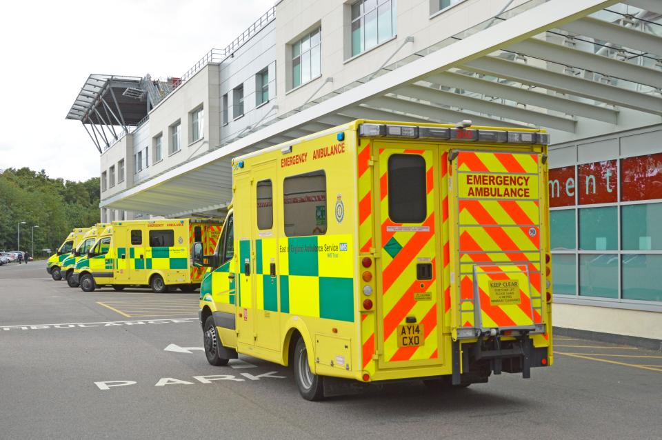 an emergency ambulance is parked outside of a hospital