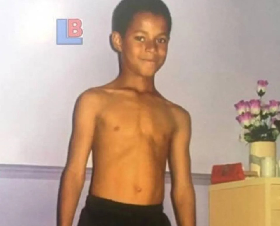 Marcus Rashford smiles for the camera as a youngster