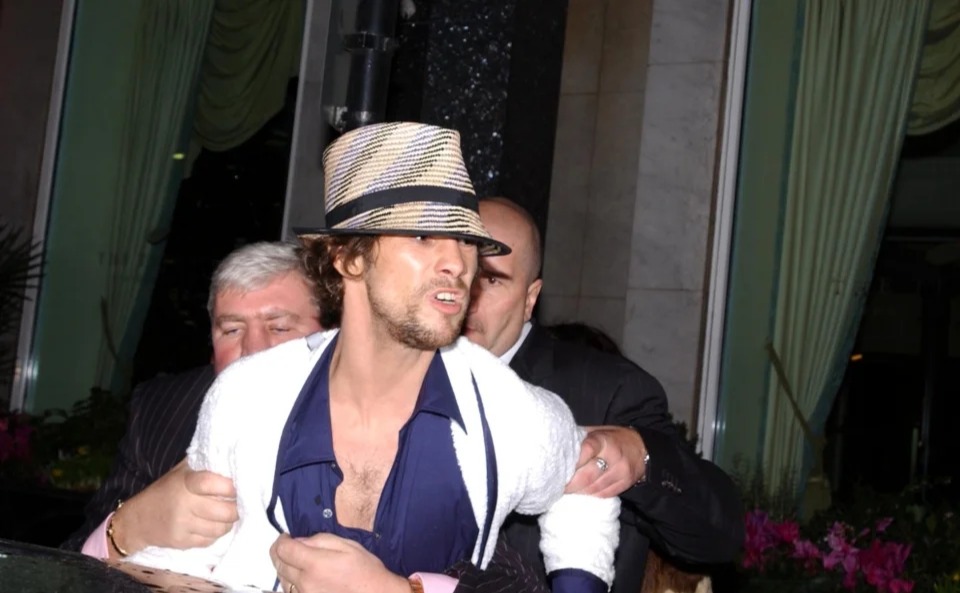 Jay Kay being restrained by security staff after the Brits bash in 2002