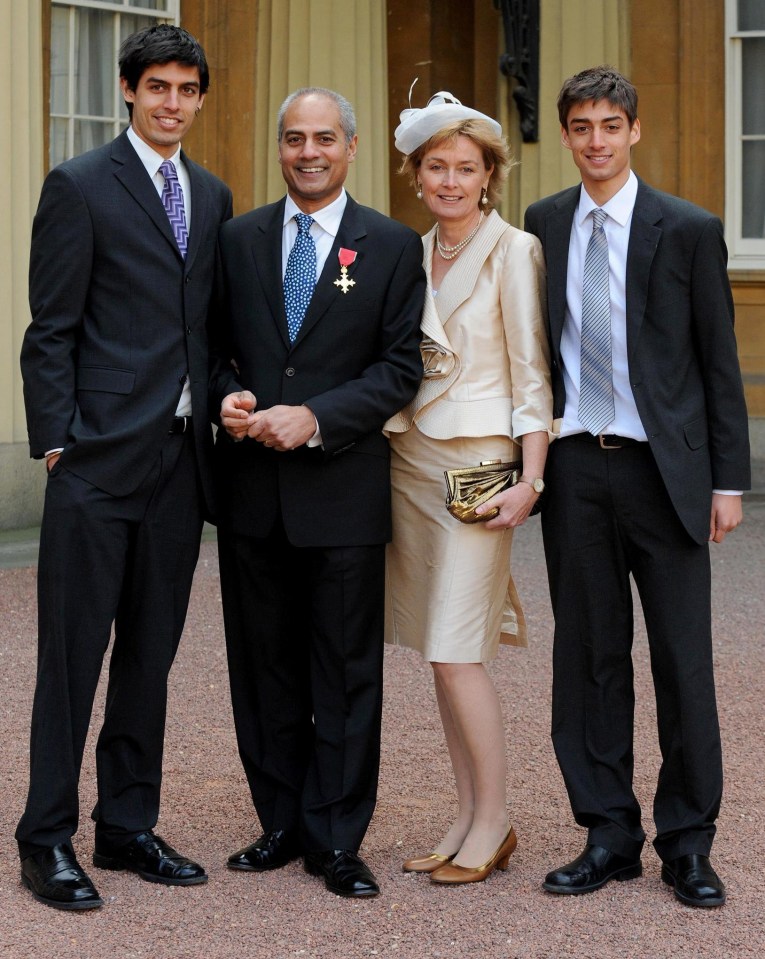 George Alagiah and wife Frances, accompanied by their sons Adam, left and Matt, right, at Buckingham Palace